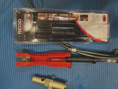 Small fins on Delta faucet wrench fitting neatly into slots in Ridgid tool